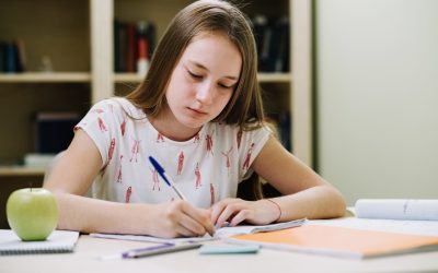 teen-girl-sitting-and-writing